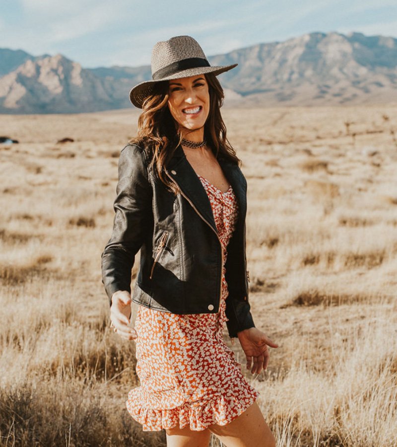 UPLVL Coaching founder Heather Doane standing in a golden field